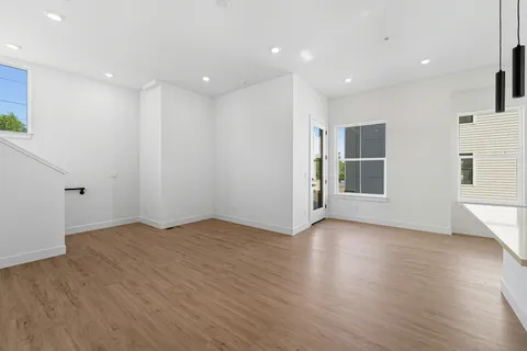 a view of kitchen with wooden floor and window