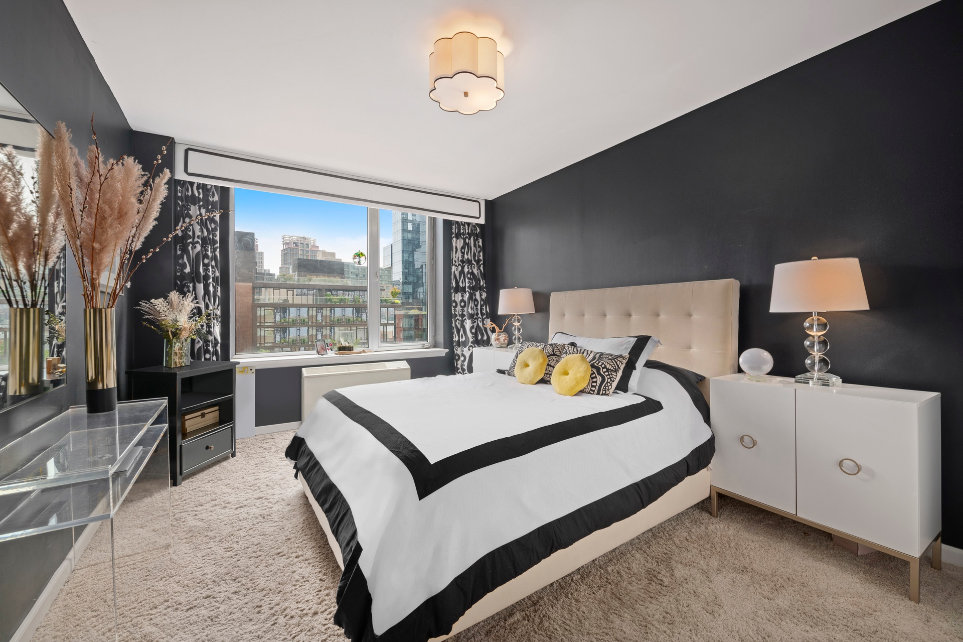 26 Broadway, Unit 602 Brooklyn, NY 11249 - Photo 5 of 12 a bed room with a bed and a night stand