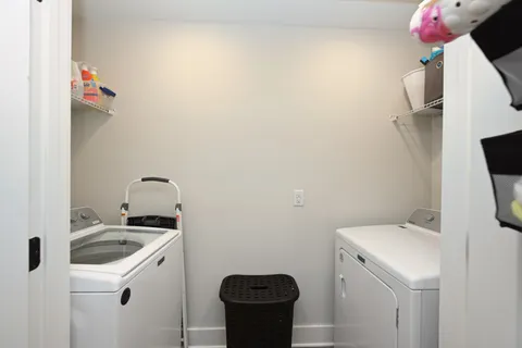 a view of storage and utility room with a sink