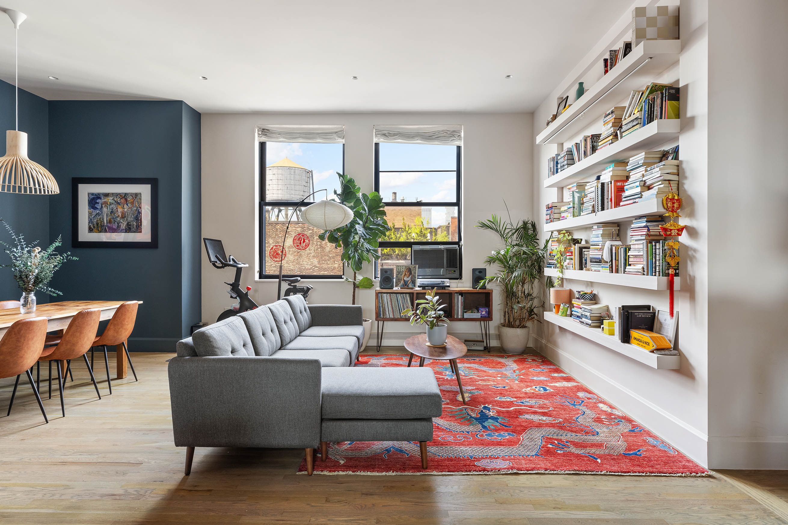 a living room with fireplace furniture and a book shelf