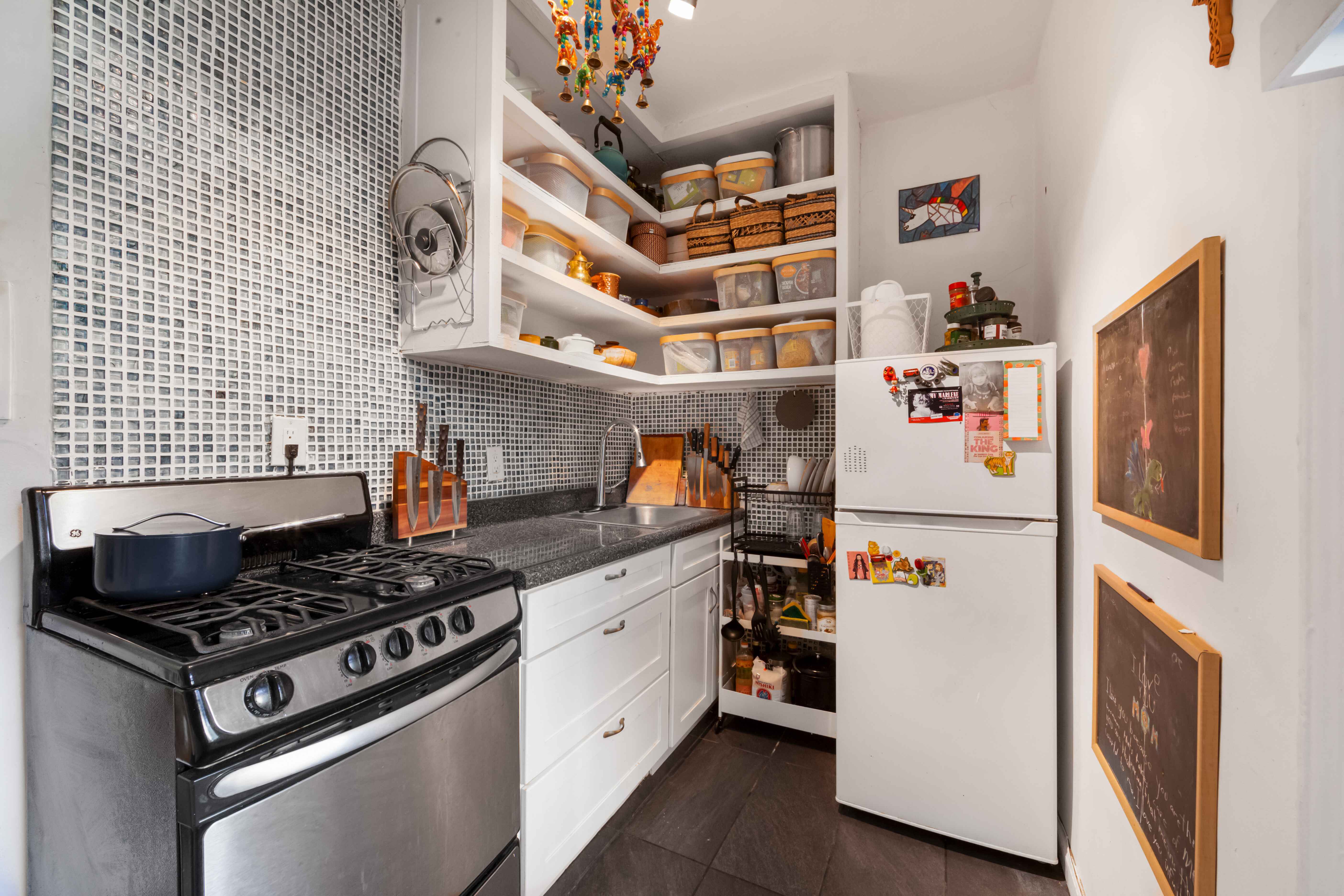 260 Ocean Parkway, Unit 5G Brooklyn, NY 11218 - Photo 6 of 10 a kitchen with stainless steel appliances granite countertop a stove and a refrigerator