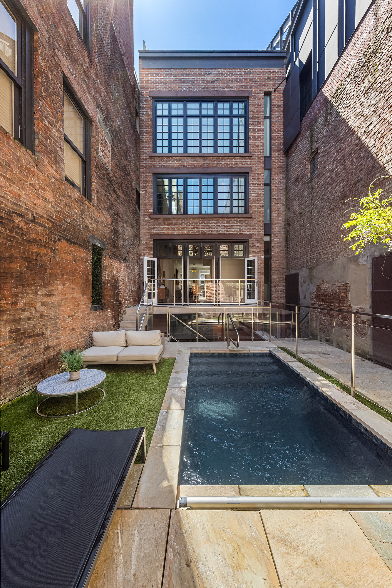 21 Cornelia Street Manhattan, NY 10014 - Photo 4 of 26 a view of a house with swimming pool