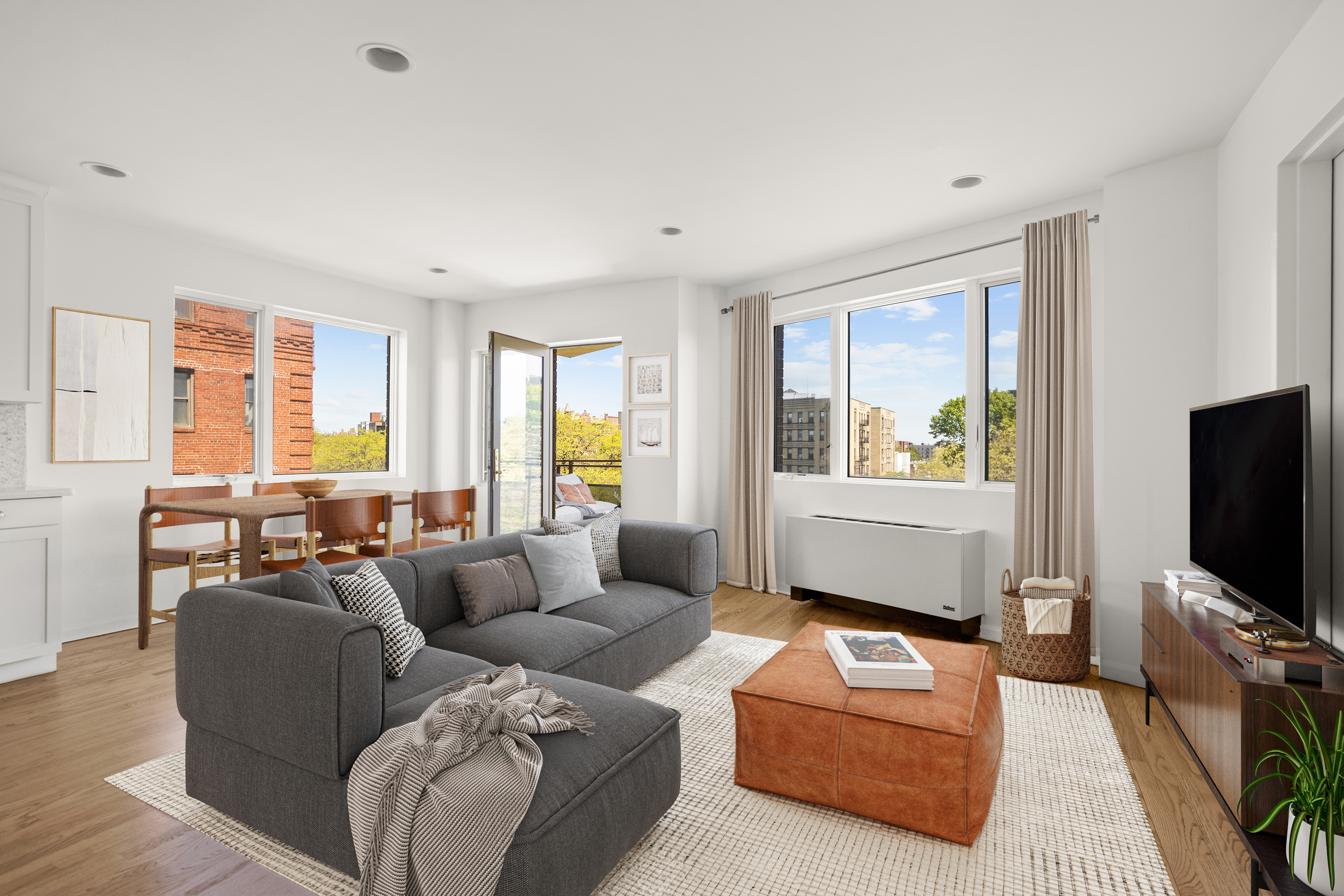 702 Ocean Parkway, Unit 5R Brooklyn, NY 11230 - Photo 1 of 13 a living room with furniture and a flat screen tv