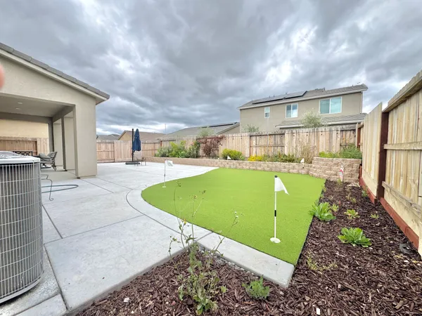 a view of a swimming pool with an outdoor seating