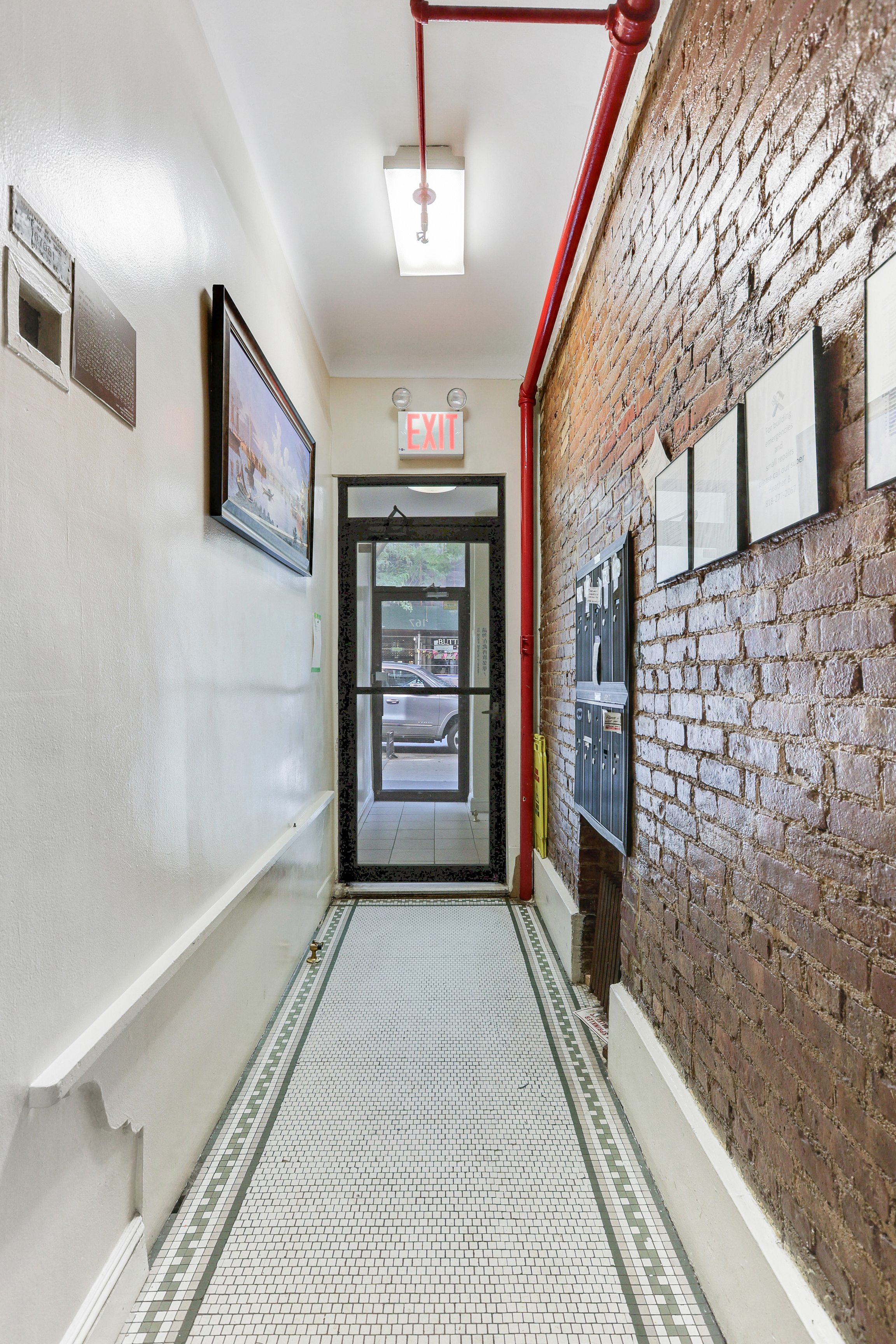 167 West 72nd Street Manhattan, NY 10023 - Photo 12 of 25 a view of hallway with a large mirror and a shower
