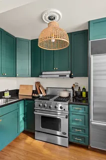 a kitchen with a stove and a microwave