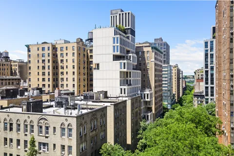 a view of city with tall buildings