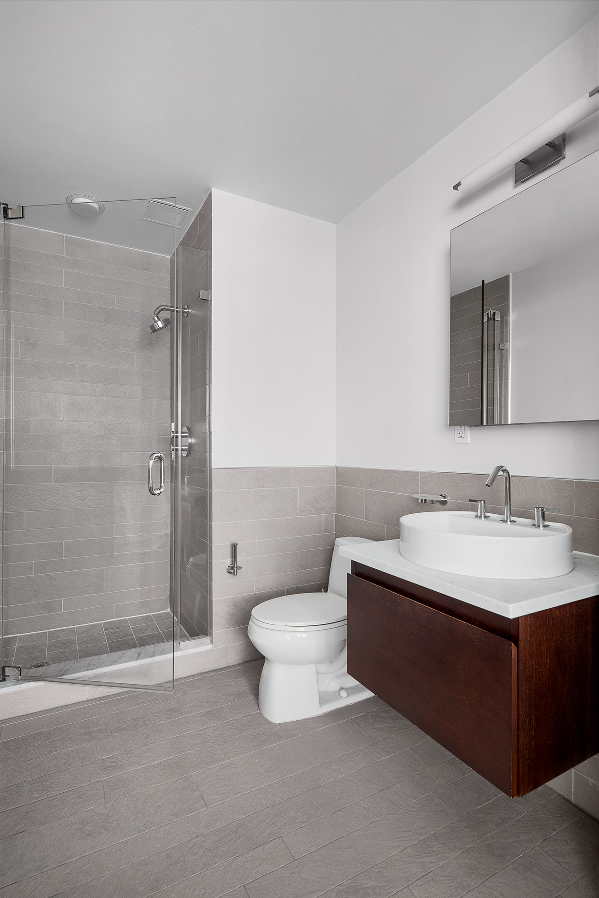 125 West 21st Street, Unit 5B Manhattan, NY 10011 - Photo 9 of 15 a bathroom with a sink toilet and shower