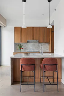 a kitchen with a sink cabinets and window