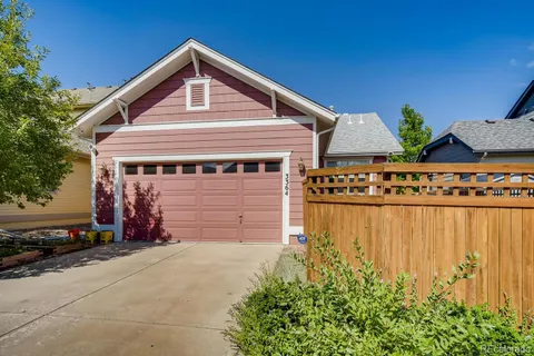 a front view of a house with garage