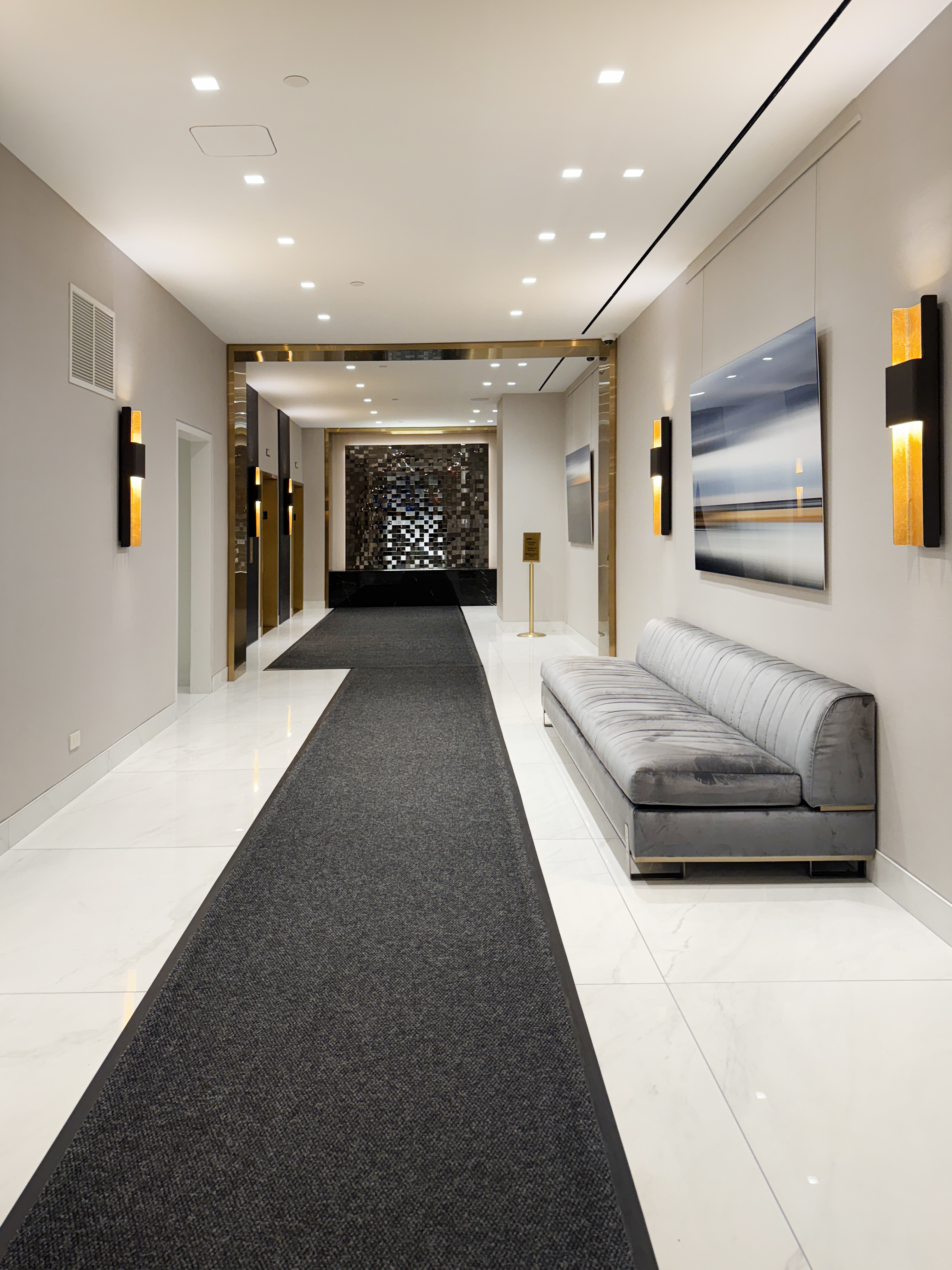 150 West 51st Street, Unit 1528 Manhattan, NY 10019 - Photo 15 of 21 a living room with furniture and a flat screen tv