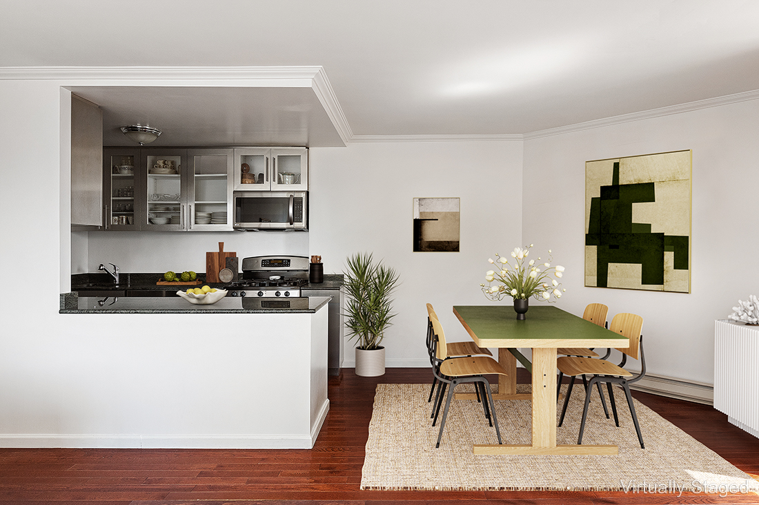 1619 3rd Avenue, Unit 21H Manhattan, NY 10128 - Photo 3 of 16 a kitchen with a table and chairs in it
