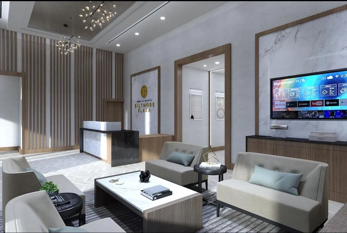 a living room with furniture and a flat screen tv