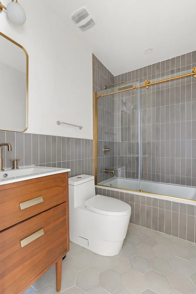 a bathroom with a bathtub and a sink