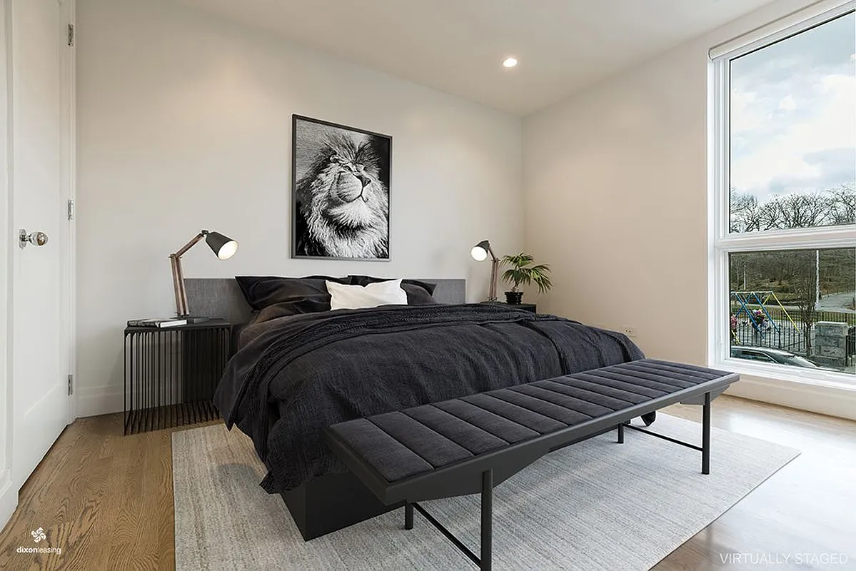 2001 5th Avenue, Unit 2 Manhattan, NY 10035 - Photo 3 of 9 a bedroom with furniture and a large window