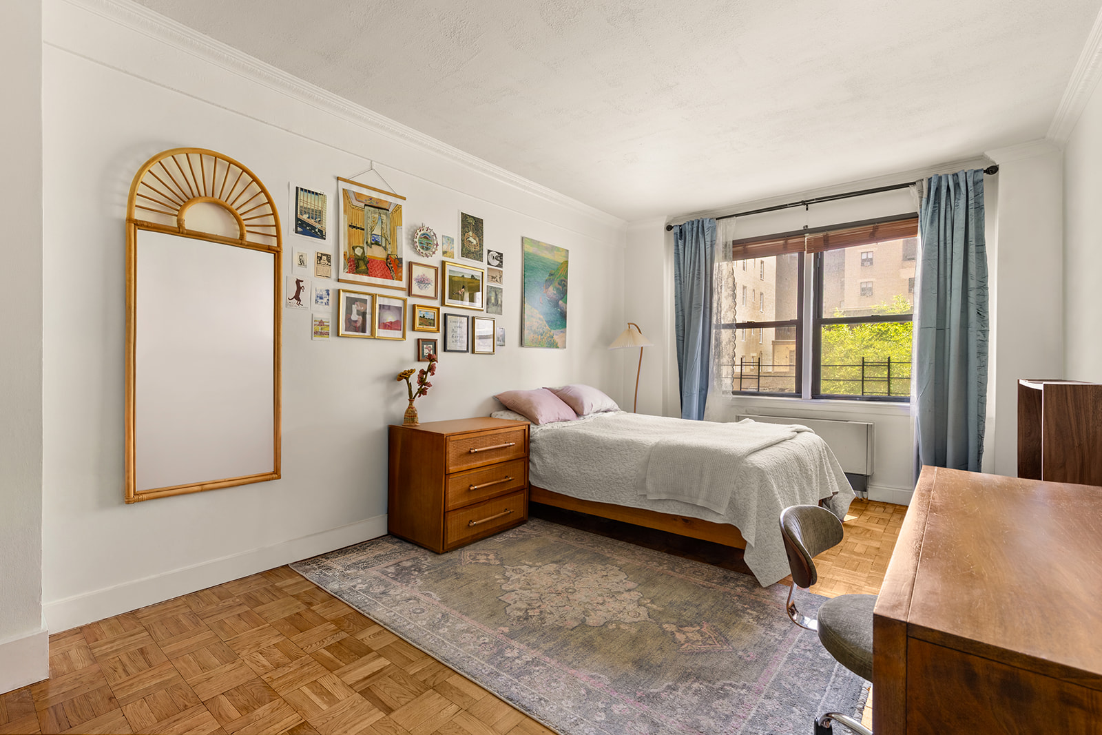 240 East 46th Street, Unit 7G Manhattan, NY 10017 - Photo 9 of 14 a bedroom with a bed and wooden floor