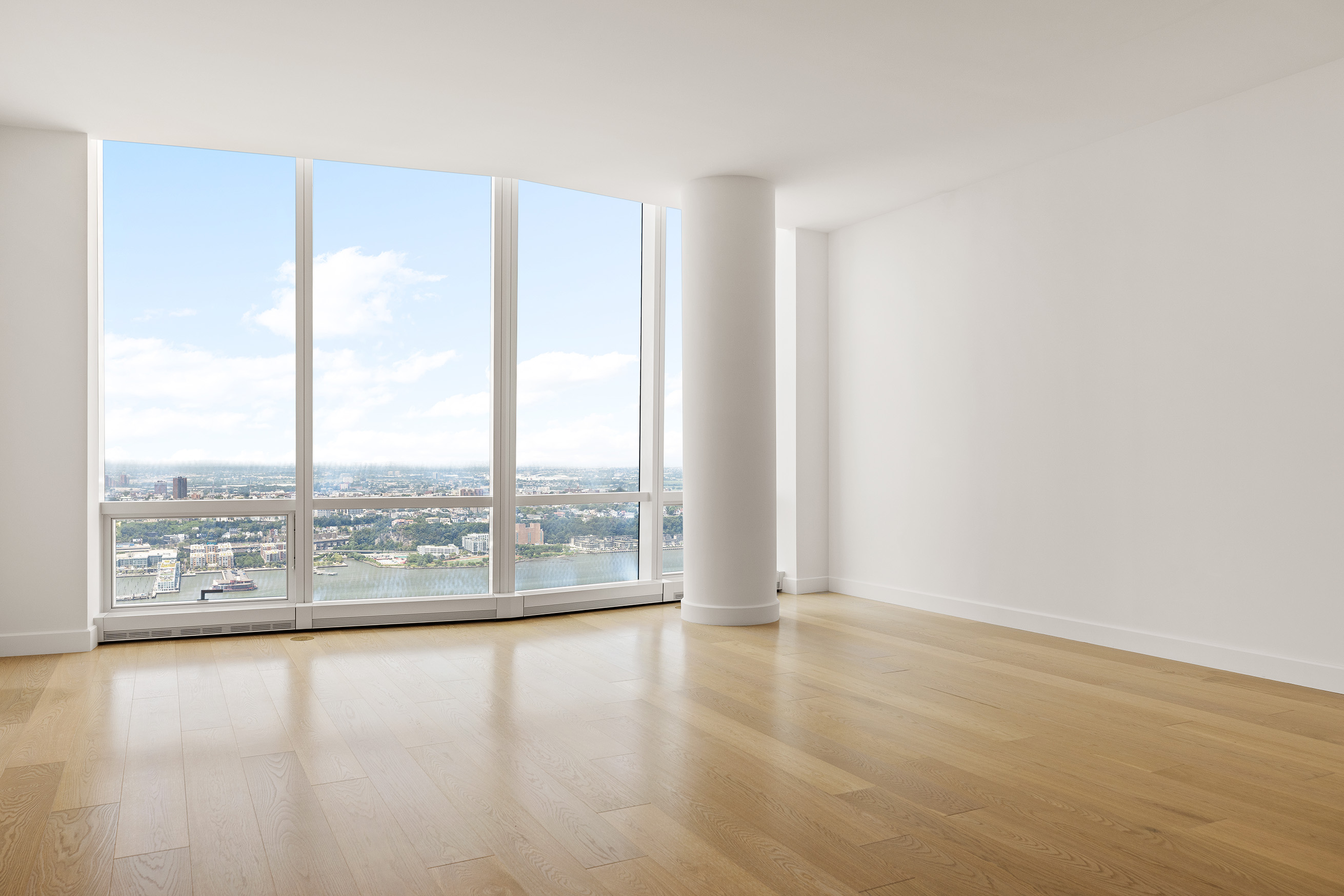 15 Hudson Yards, Unit 68C Manhattan, NY 10001 - Photo 4 of 16 an empty room with wooden floor and windows