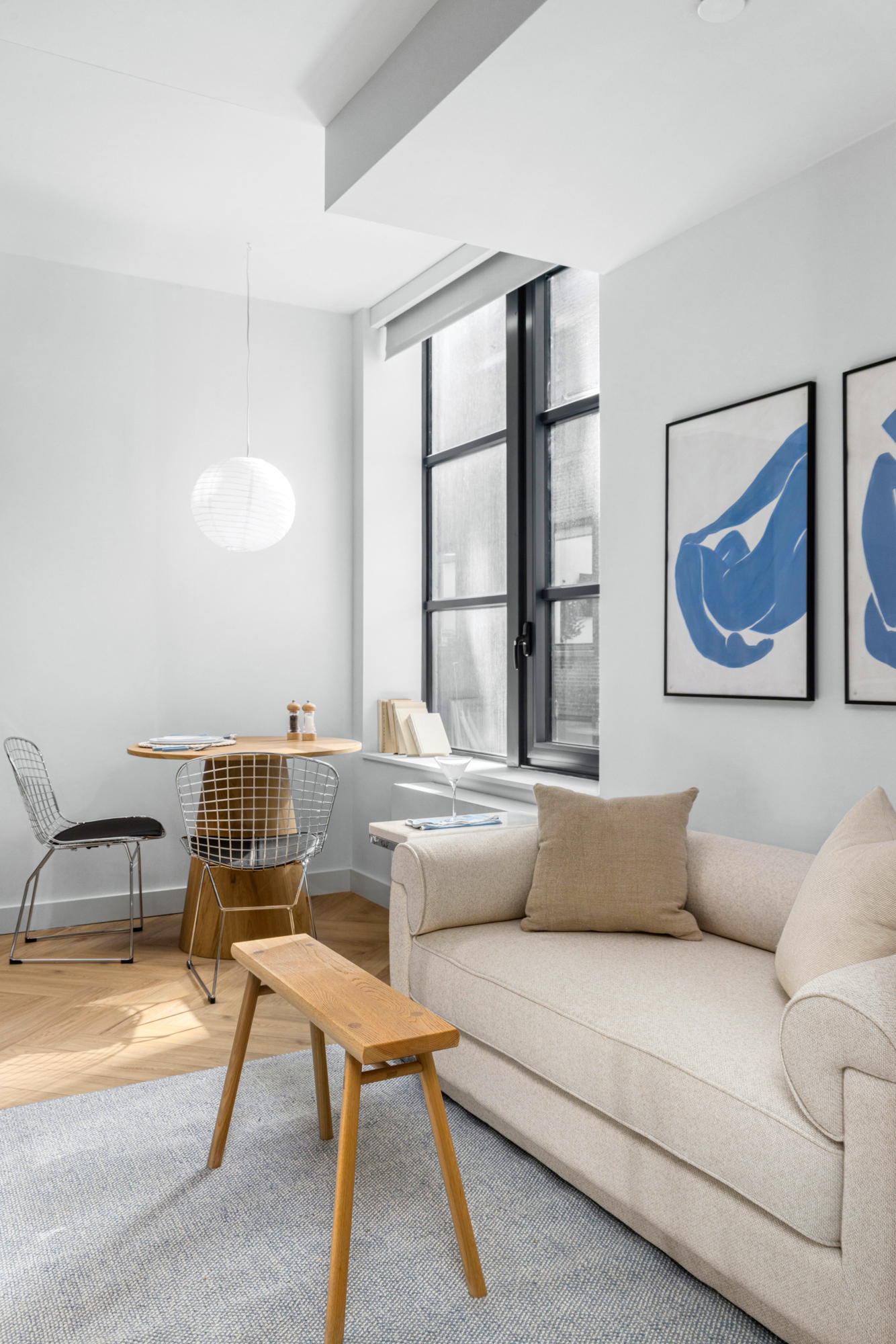 980 6th Avenue, Unit 301 Manhattan, NY 10018 - Photo 1 of 12 a living room with furniture and a window