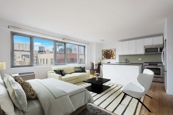 a living room with furniture and a large window