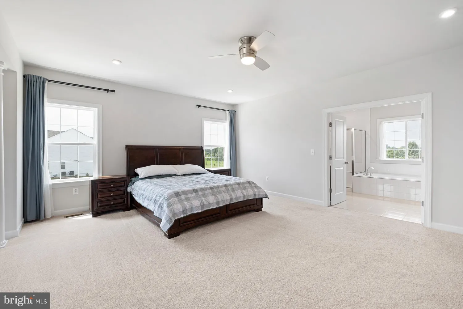 a white bath tub sitting next to a window