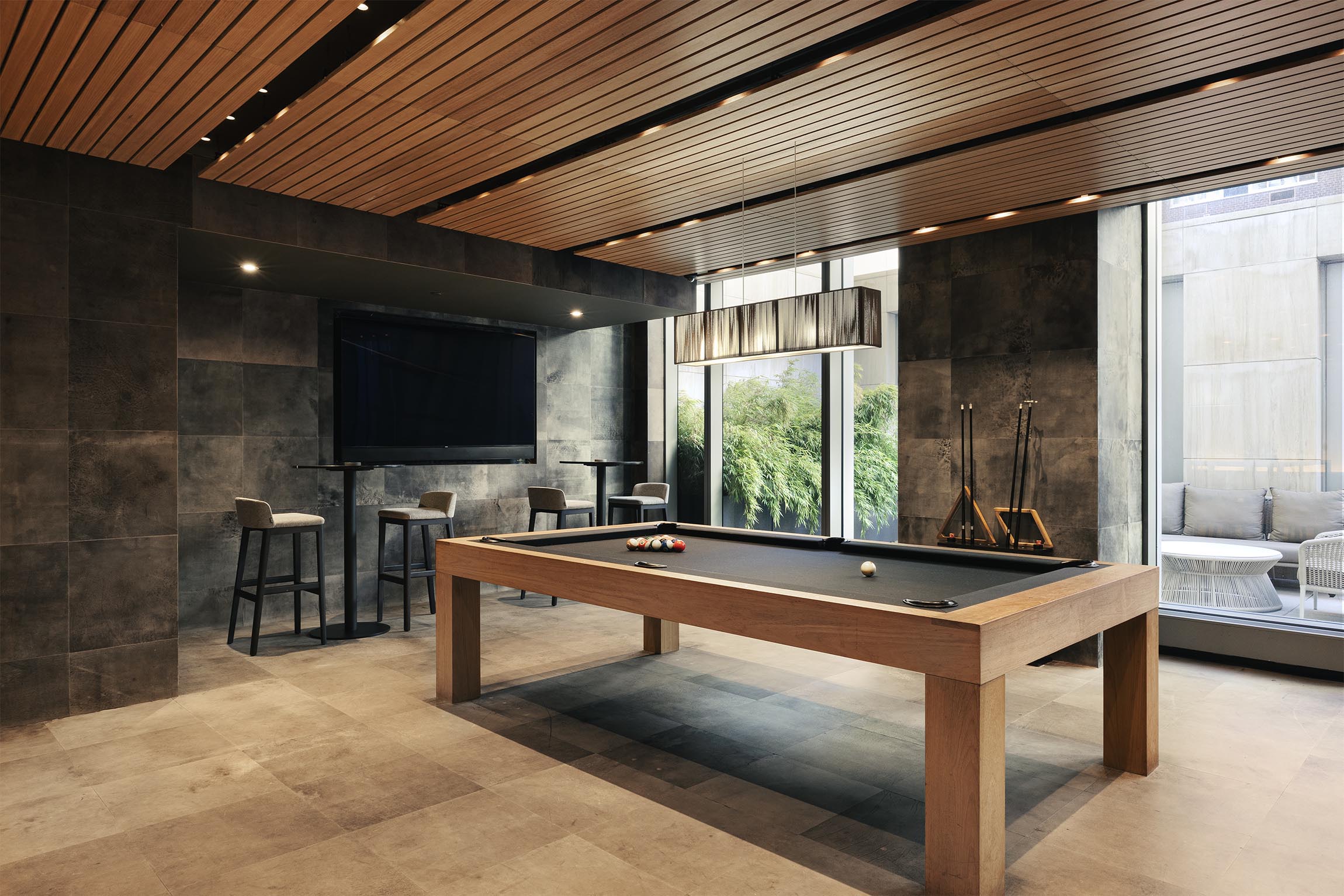 200 Amsterdam Avenue, Unit 17A Manhattan, NY 10023 - Photo 19 of 24 a room with furniture and flat screen tv