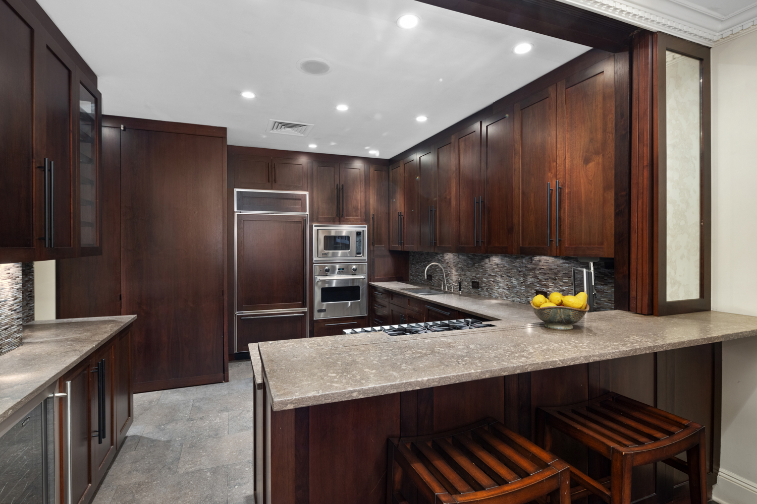 333 Central Park West, Unit 11 Manhattan, NY 10025 - Photo 8 of 21 a kitchen with sink cabinets and stainless steel appliances