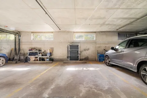 a view of a garage with parked cars