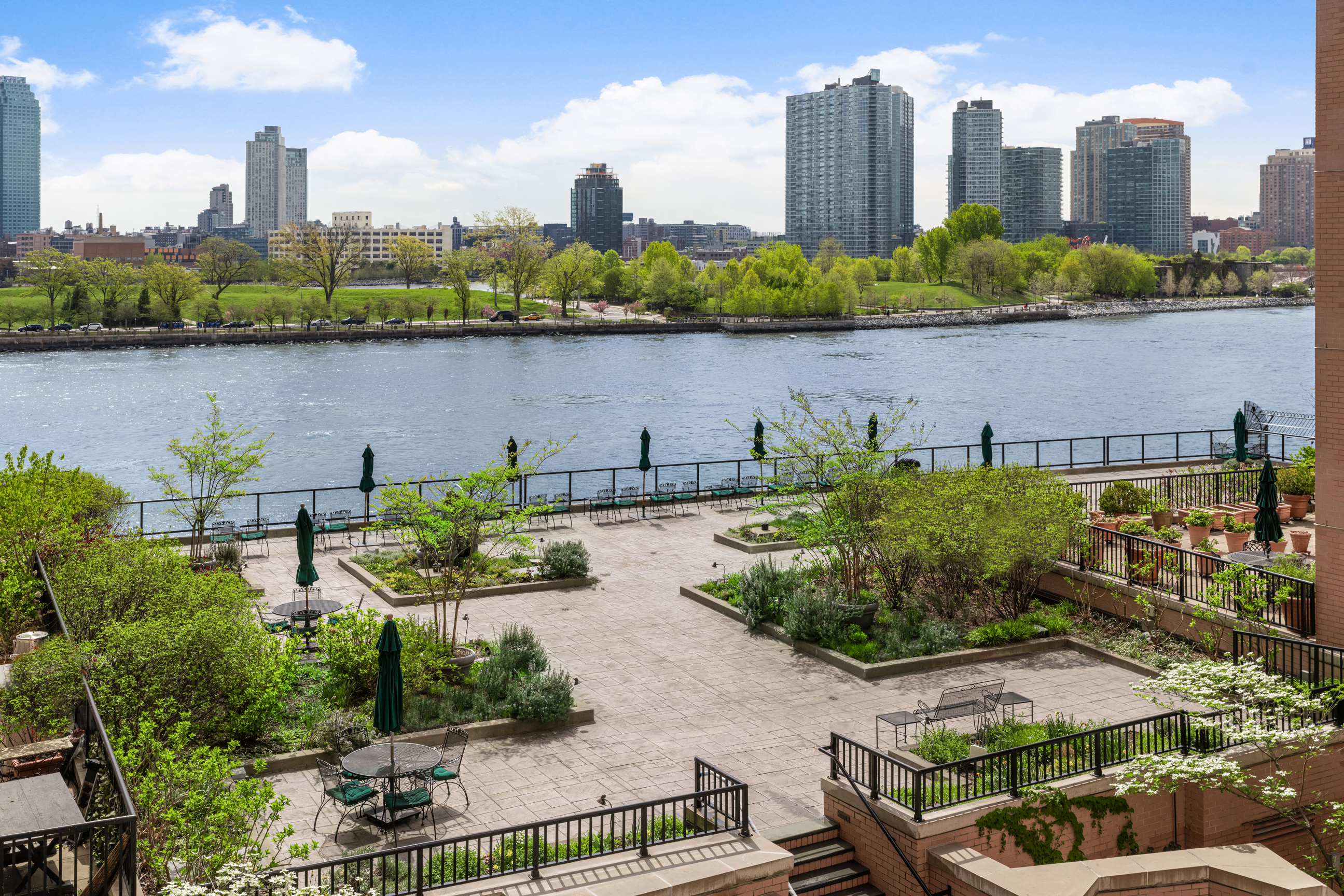 25 Sutton Place South, Unit 4I Manhattan, NY 10022 - Photo 12 of 16 a view of a city with tall buildings