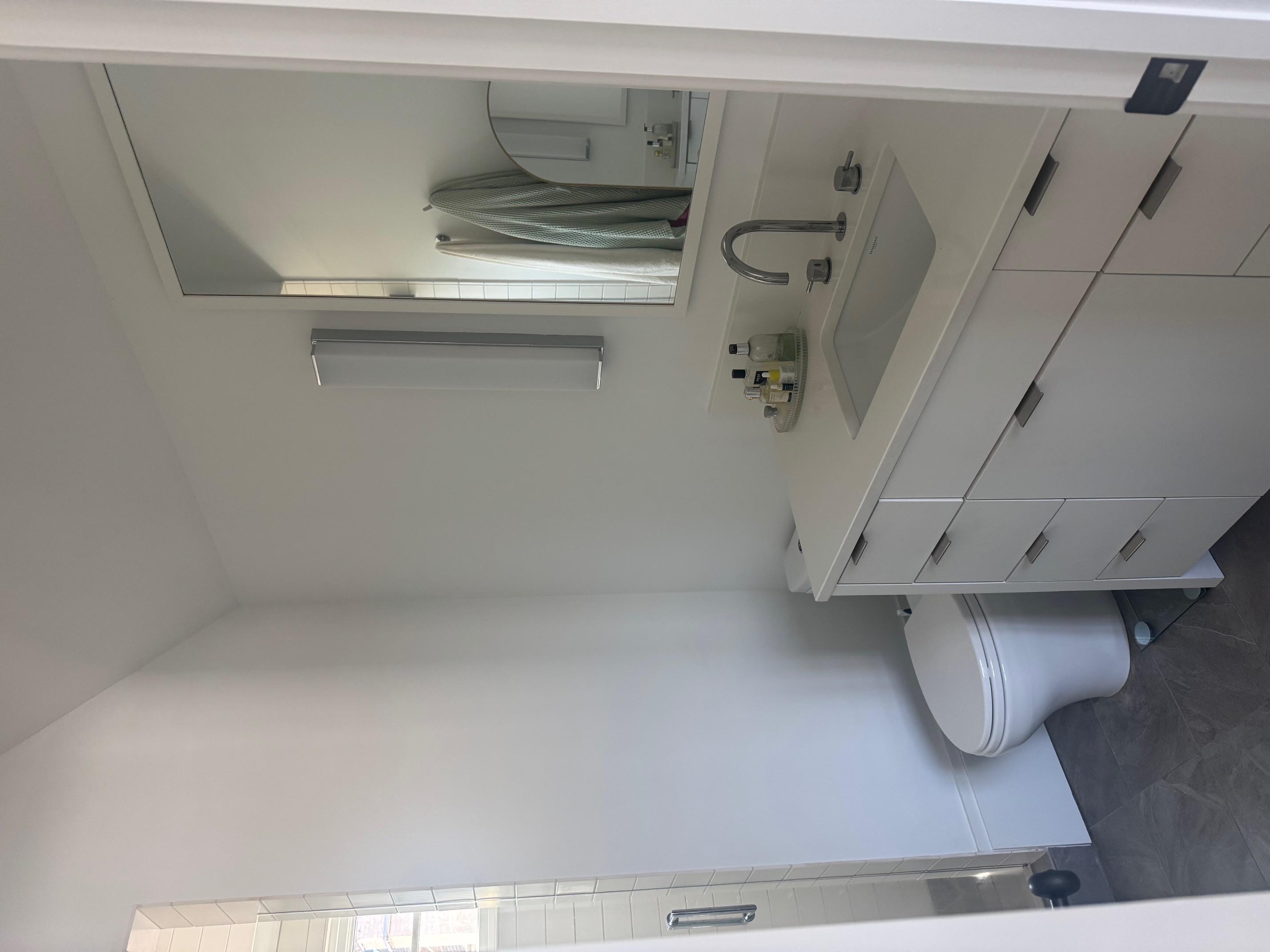 Address Upon Request Dallas, TX 75219 - Photo 9 of 12 a bathroom with a toilet sink and mirror