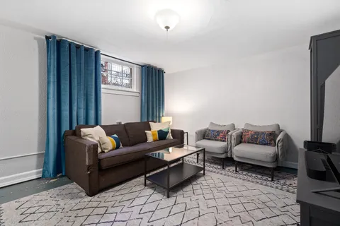 a living room with furniture and a window