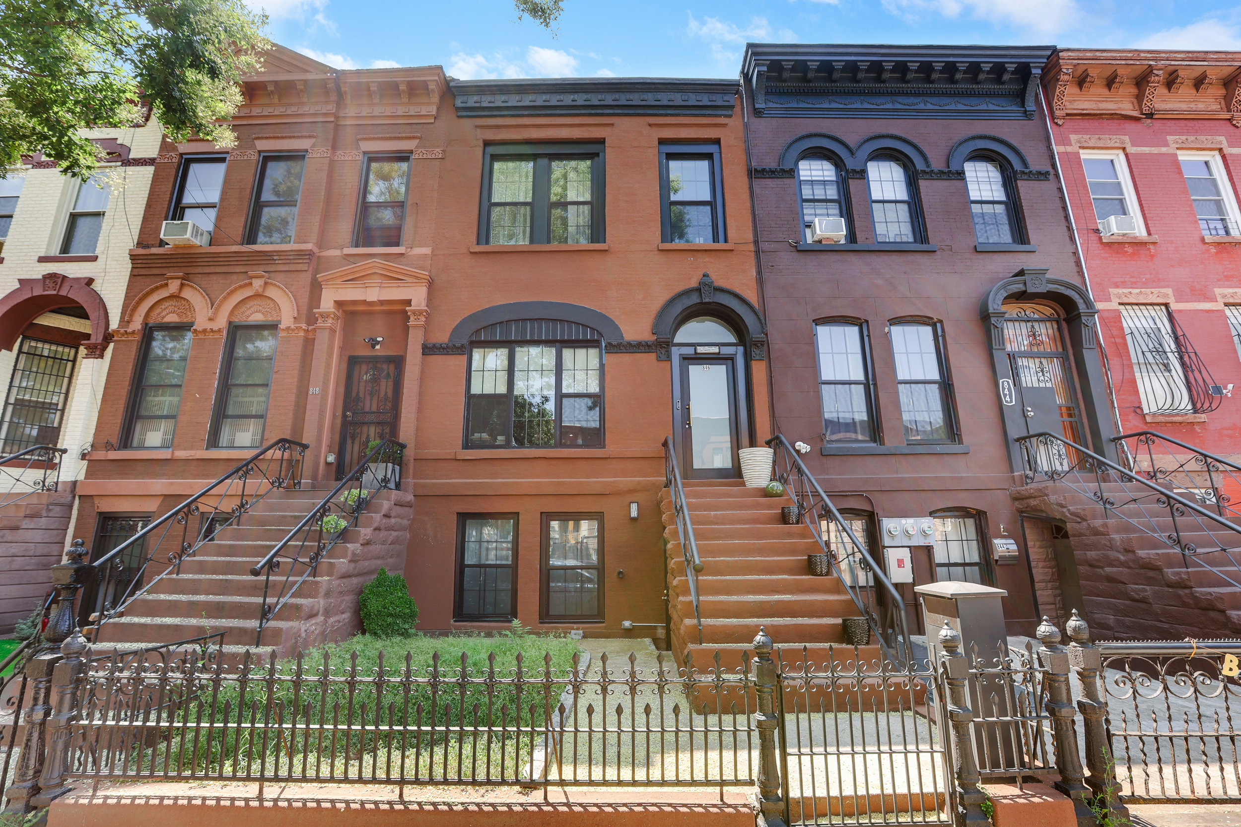 846 Hancock Street, Unit GARDEN Brooklyn, NY 11233 - Photo 9 of 17 a front view of a house with a yard