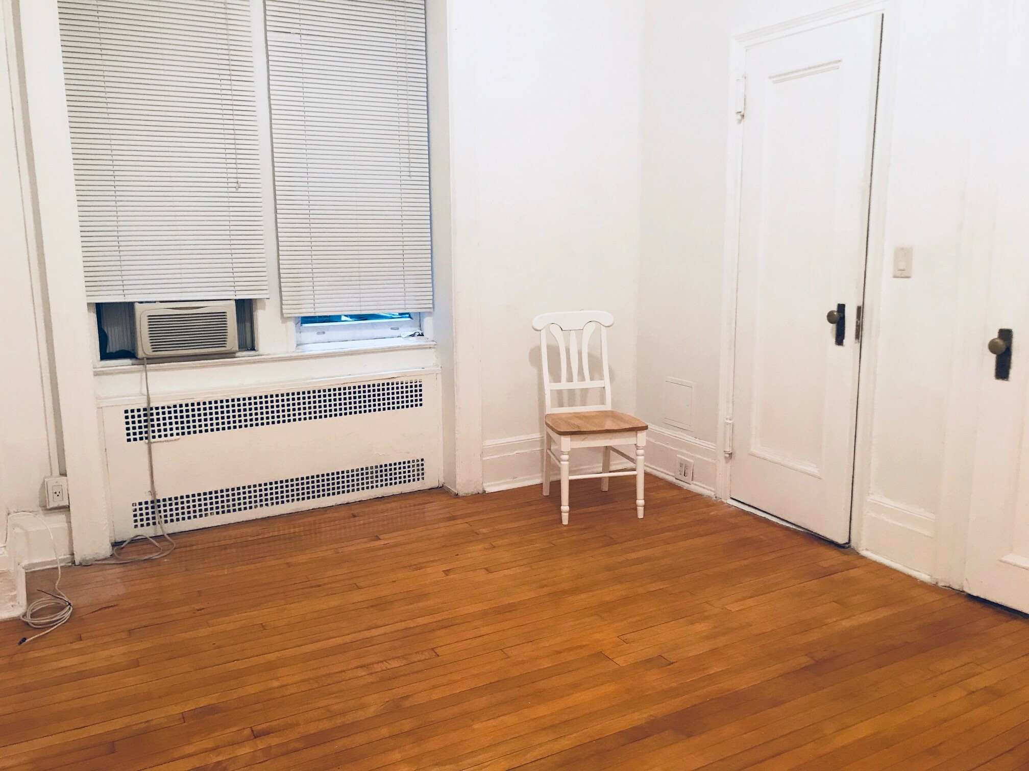 26 East 63rd Street, Unit 2E Manhattan, NY 10065 - Photo 6 of 8 a view of a room with wooden floor and furniture