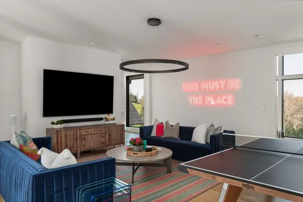a living room with furniture and a fireplace