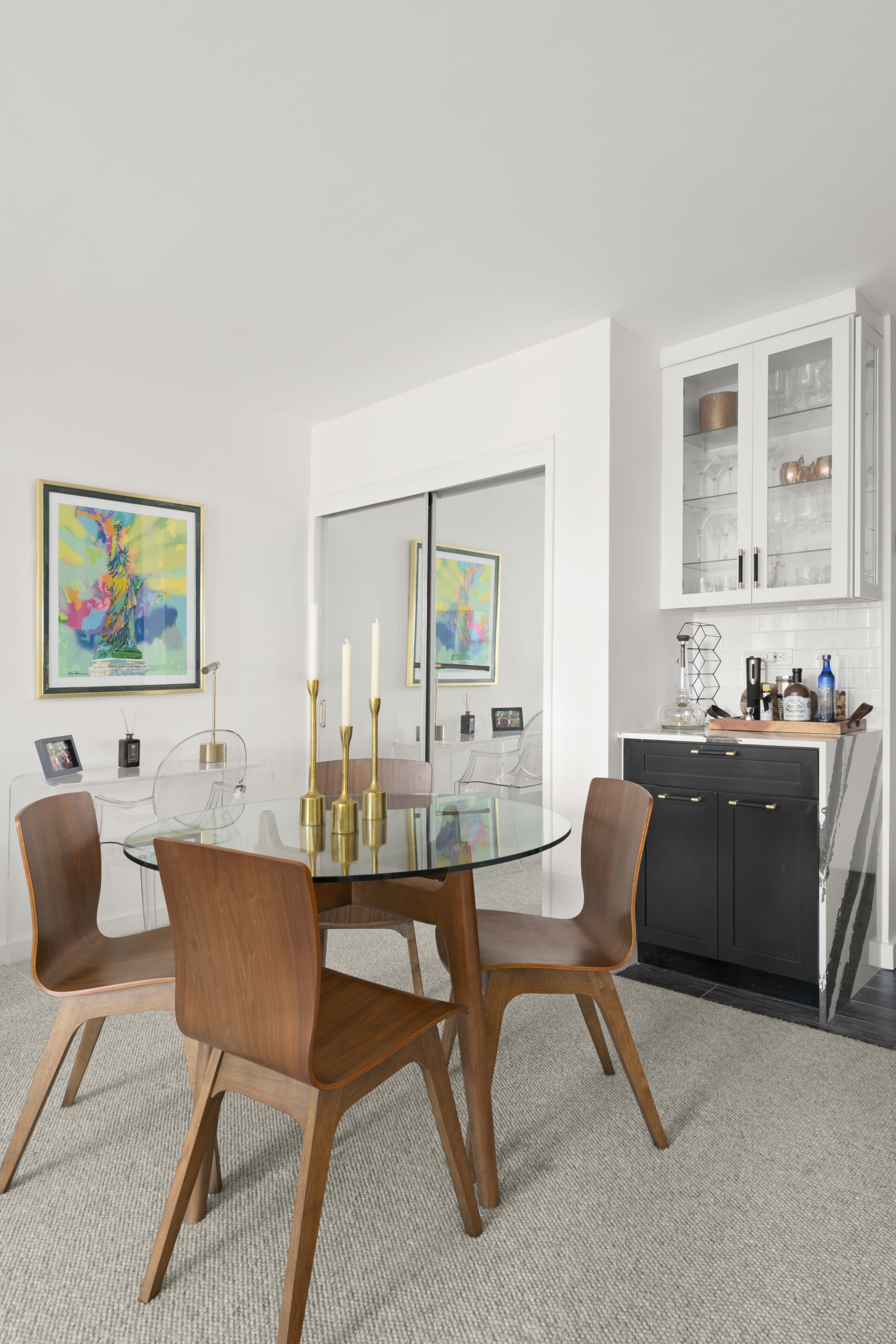 185 West End Avenue, Unit 11P Manhattan, NY 10023 - Photo 3 of 10 a living room with furniture and a dining table with wooden floor