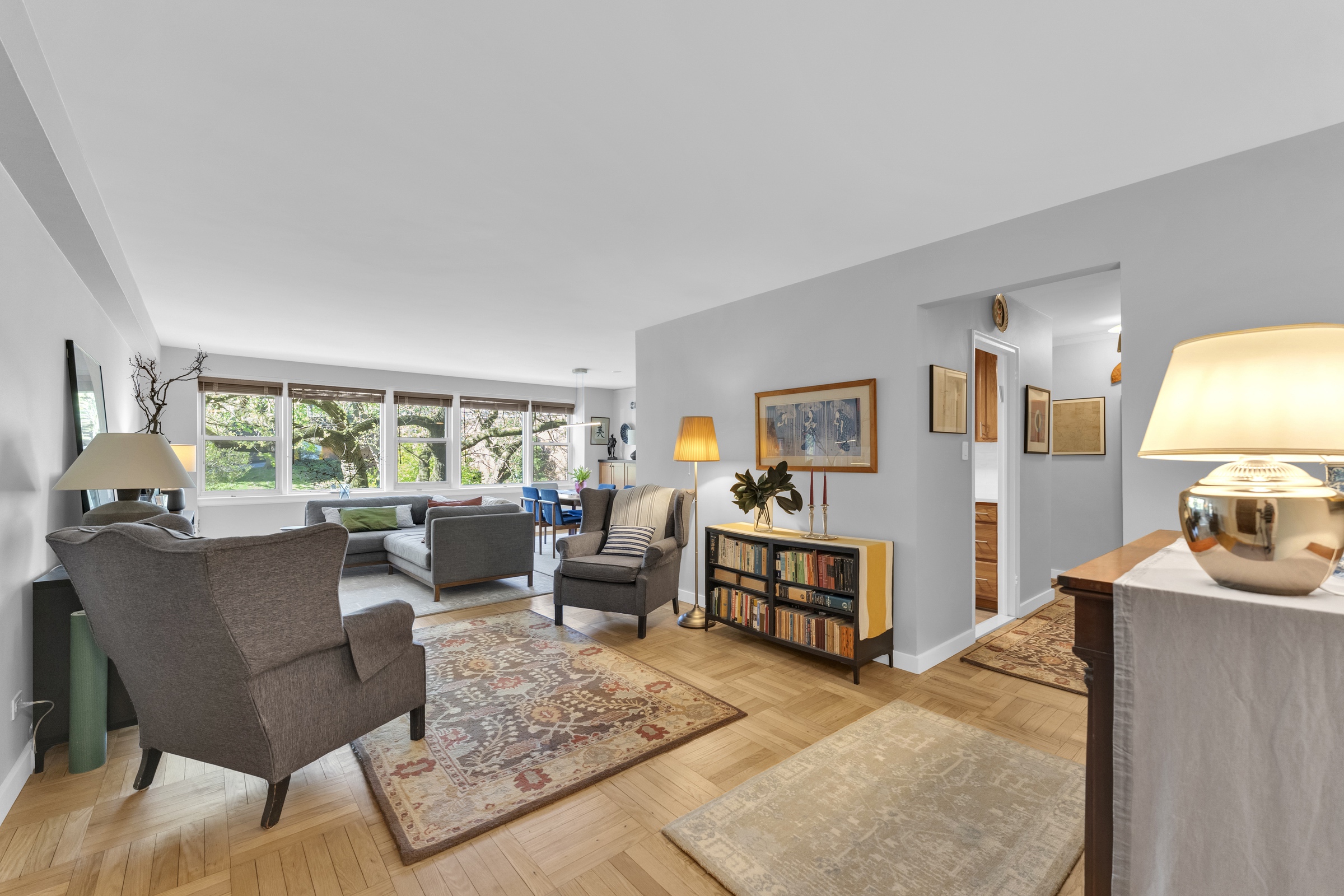4555 Henry Hudson Parkway West, Unit A310 Bronx, NY 10471 - Photo 2 of 16 a living room with furniture and a large window