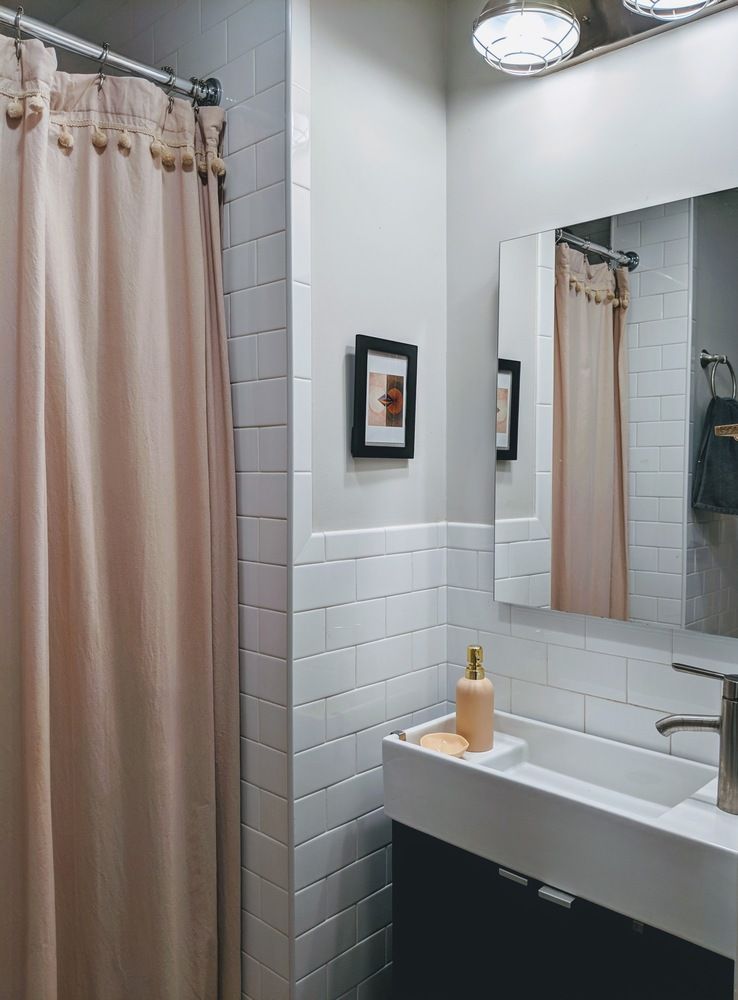 283 Devoe Street, Unit 2RR Brooklyn, NY 11211 - Photo 7 of 11 a bathroom with a sink and a mirror