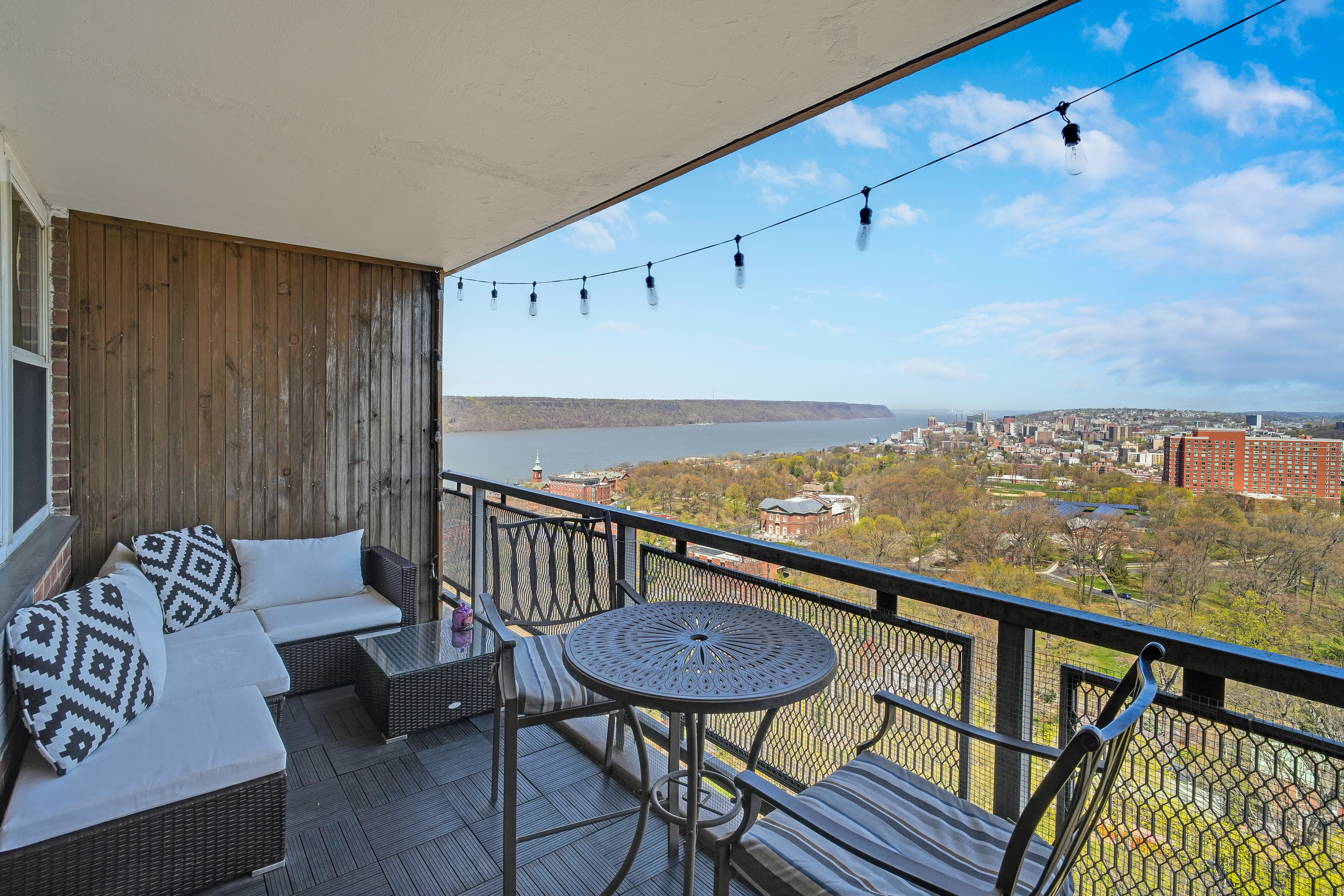 5900 Arlington Avenue, Unit 17W Bronx, NY 10471 - Photo 9 of 14 a view of a balcony with furniture
