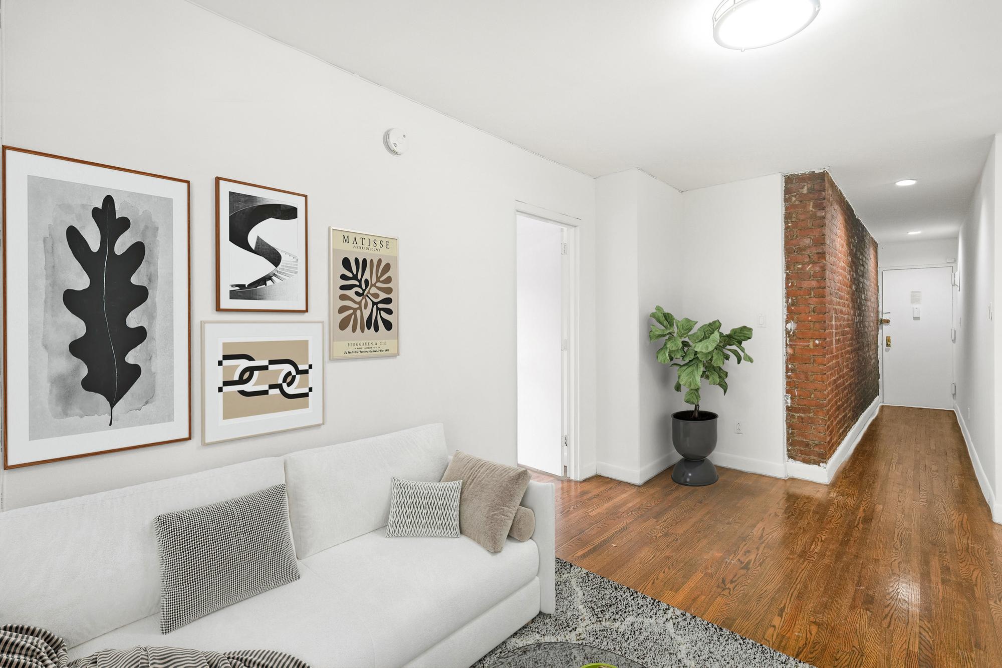 24 East 97th Street, Unit 6 Manhattan, NY 10128 - Photo 2 of 7 a living room with furniture and flowers