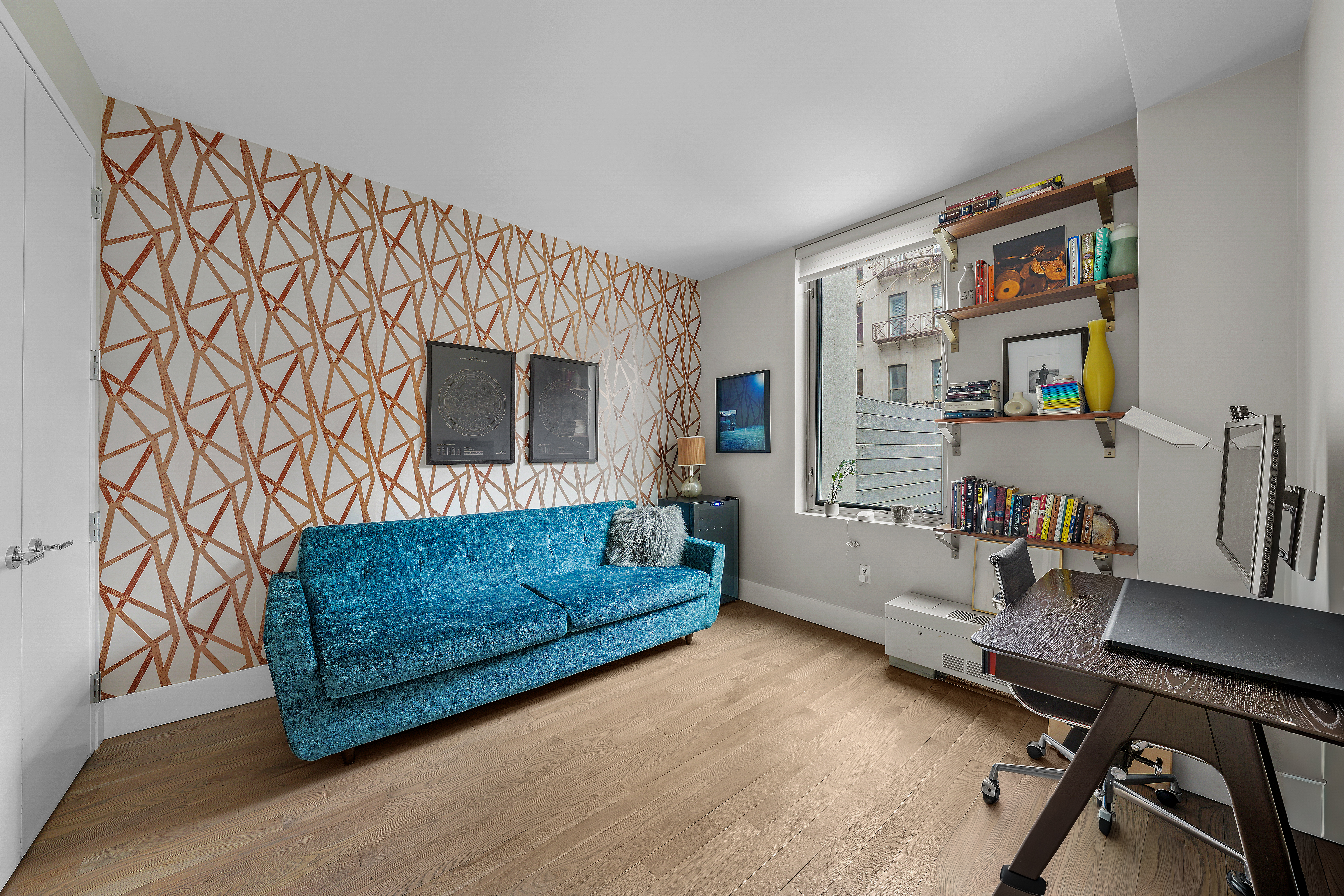 117 West 123rd Street, Unit 1B Manhattan, NY 10027 - Photo 11 of 25 a living room with furniture and a flat screen tv