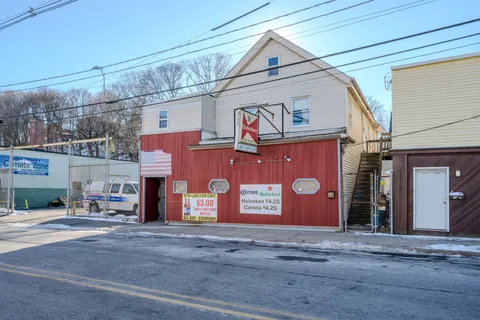 a front view of a building with a street