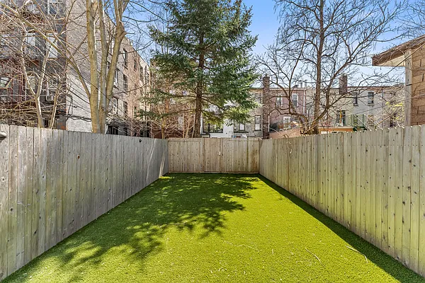 488 Sterling Place, Unit 4A Brooklyn, NY 11238 - Photo 12 of 13 a view of a yard with wooden fence