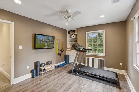 a room with gym equipment and a large window
