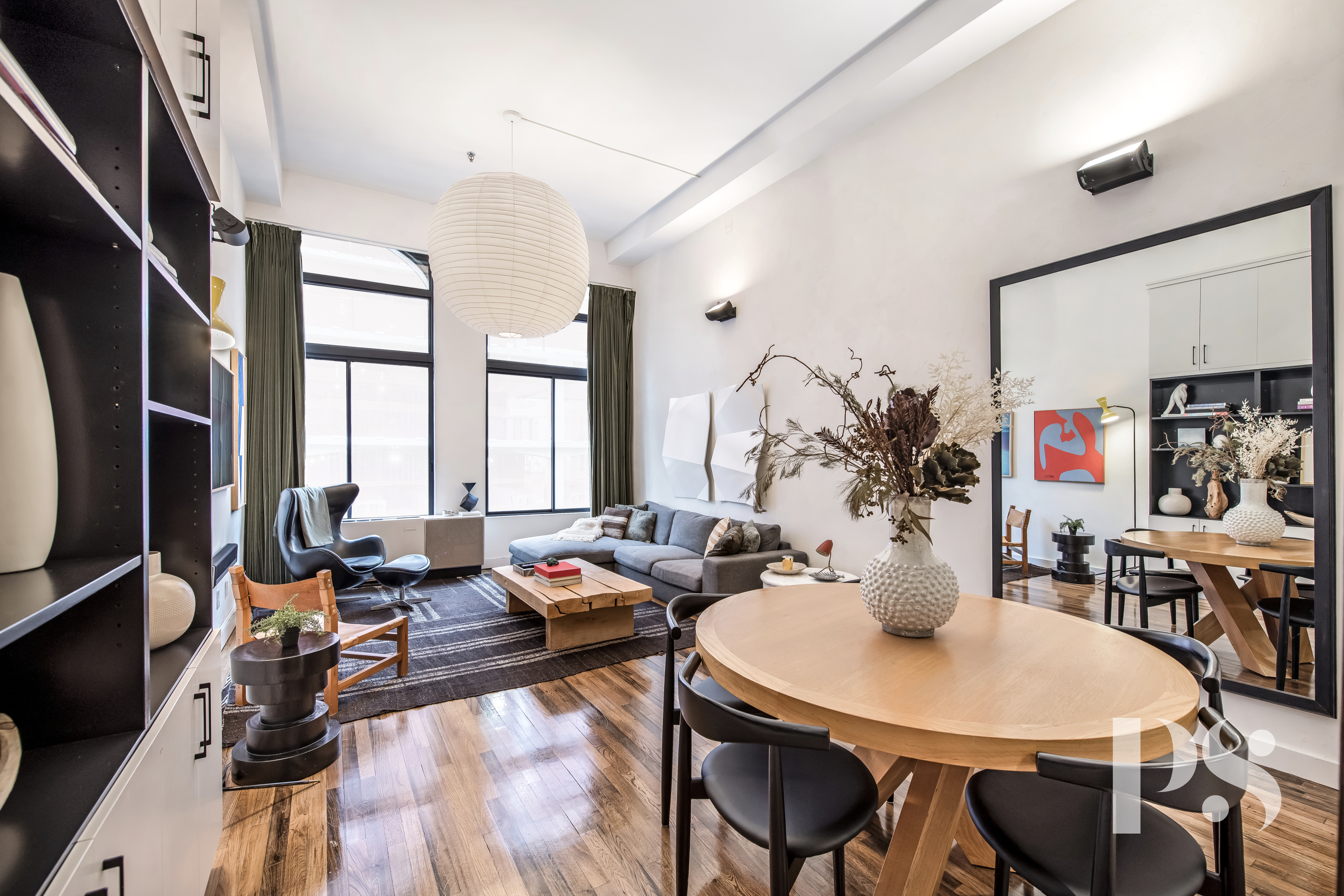 67 East 11th Street, Unit 517 Manhattan, NY 10003 - Photo 1 of 13 a view of a dining room with furniture window and wooden floor