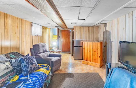 a bathroom with a sink a bathtub and a window