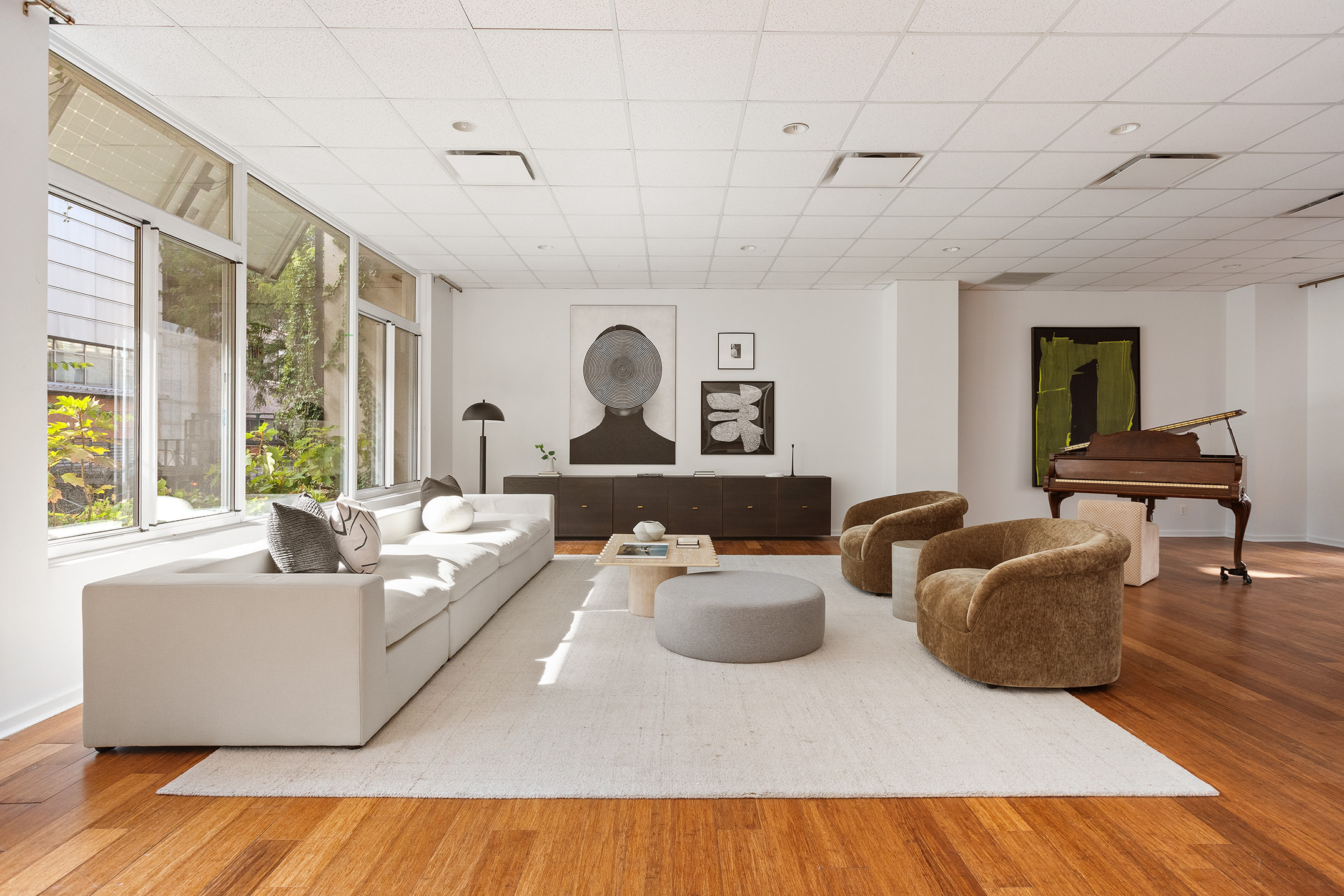 345 West 54th Street Manhattan, NY 10019 - Photo 17 of 22 a living room with furniture and a large window