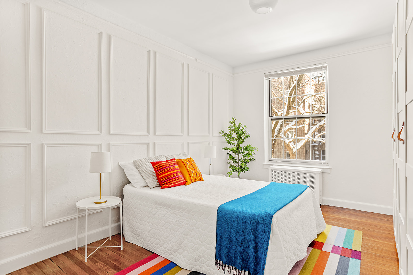 37-51 84th Street, Unit 21 Queens, NY 11372 - Photo 7 of 10 a bedroom with a bed and a window