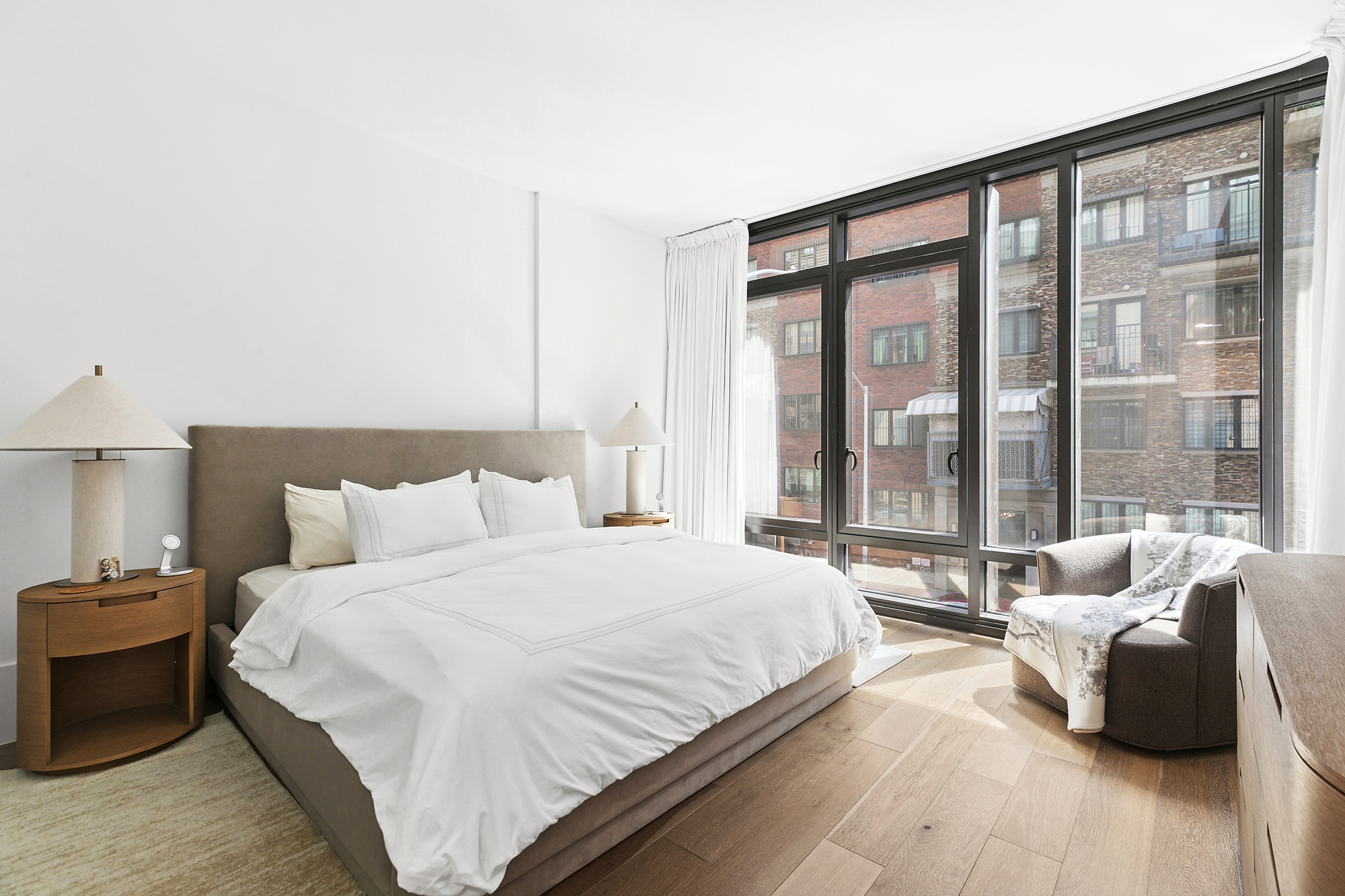 429 Kent Avenue, Unit TH8 Brooklyn, NY 11249 - Photo 9 of 24 a bedroom with a bed and a large window