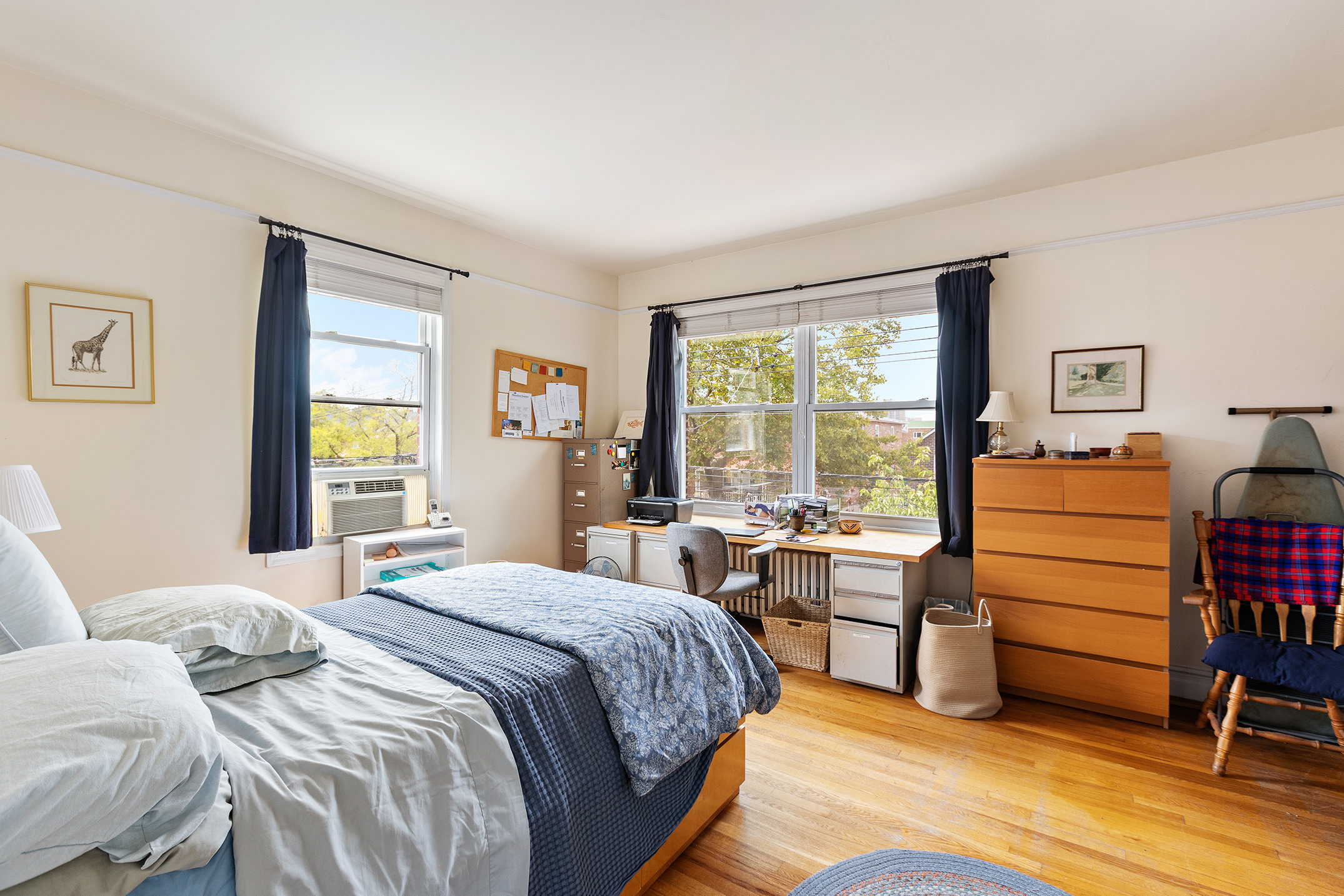 2536 Lurting Avenue Bronx, NY 10469 - Photo 13 of 27 a bedroom with a bed and large windows