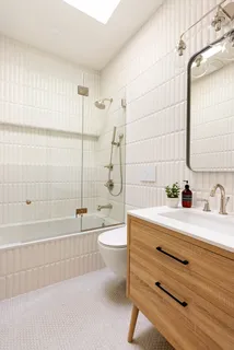 a bathroom with a sink a toilet and a bathtub