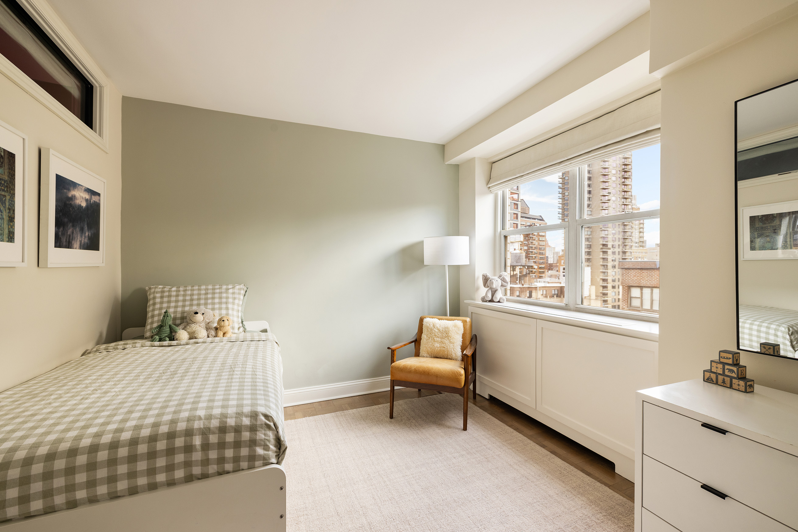 135 East 83rd Street, Unit 14B Manhattan, NY 10028 - Photo 9 of 16 a bedroom with a bed and a window